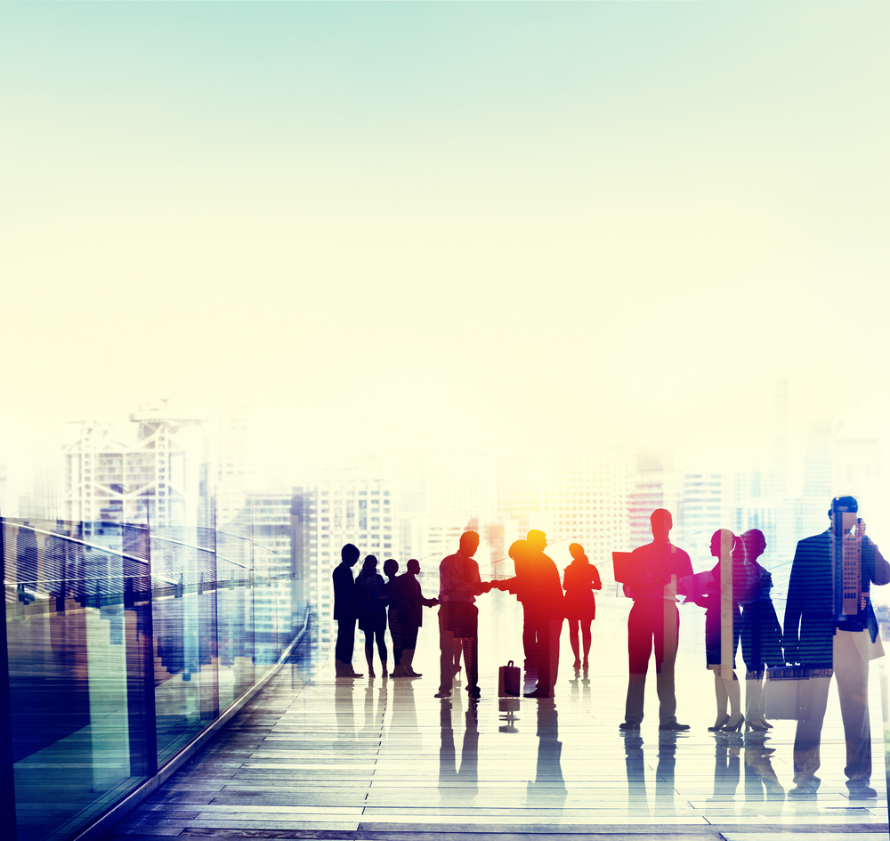People outside in groups light up in colourful colours 