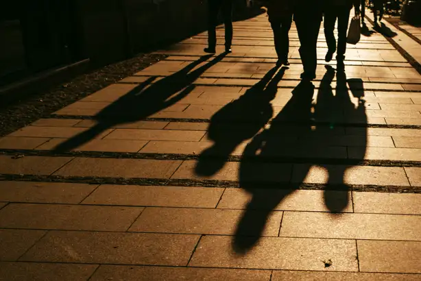 Shadows of people walking outside