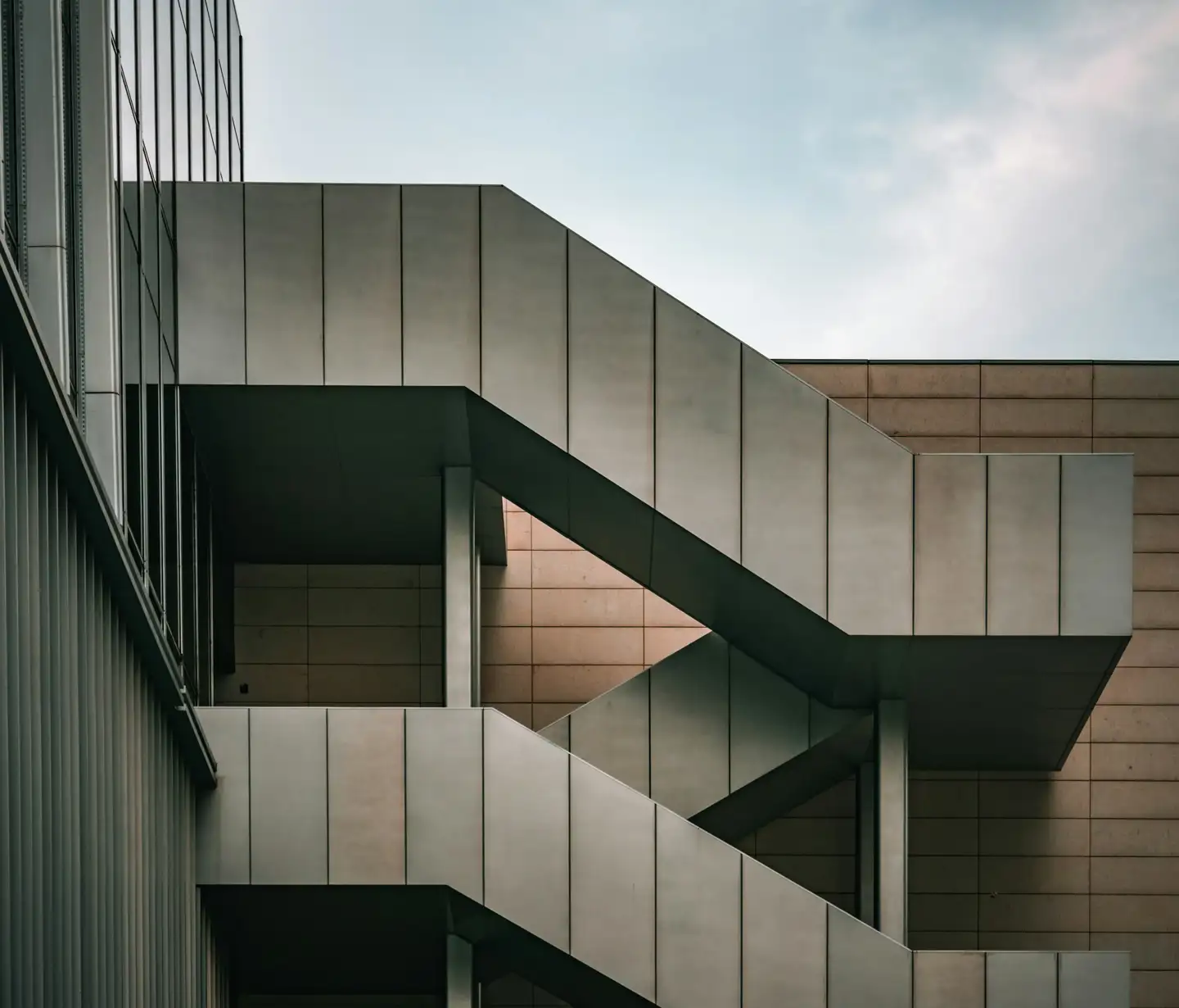 Office building with outside stairs wrapping around the building