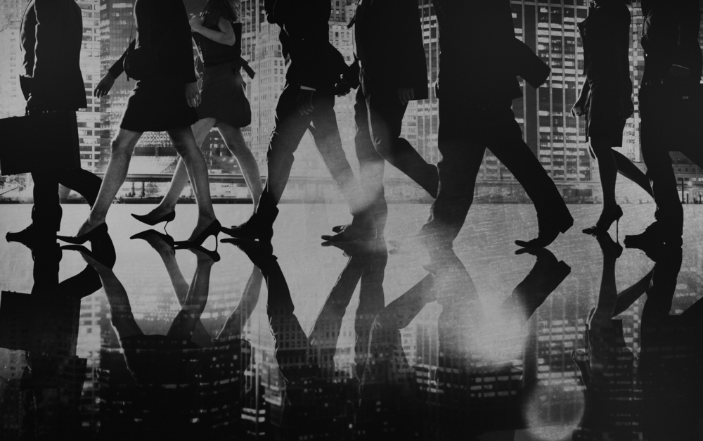 People walking image only shows legs and reflection of people walking 