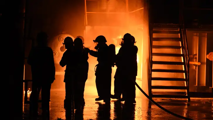 Fire fighters tackling fire