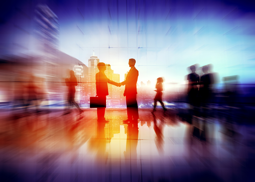 Office orange glow with two people shaking hands